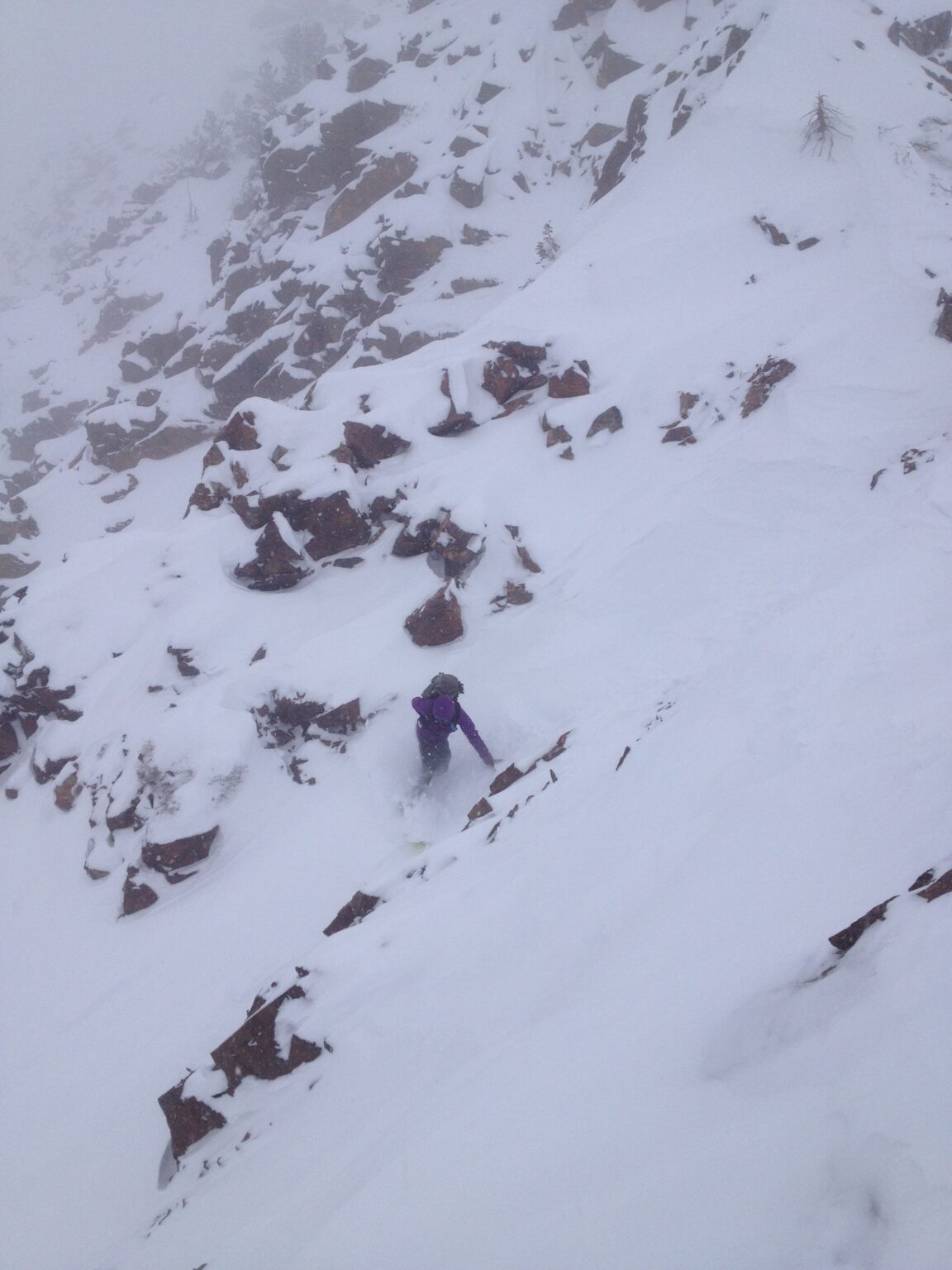 Snowboarding down the entrance of the White Pine Chute