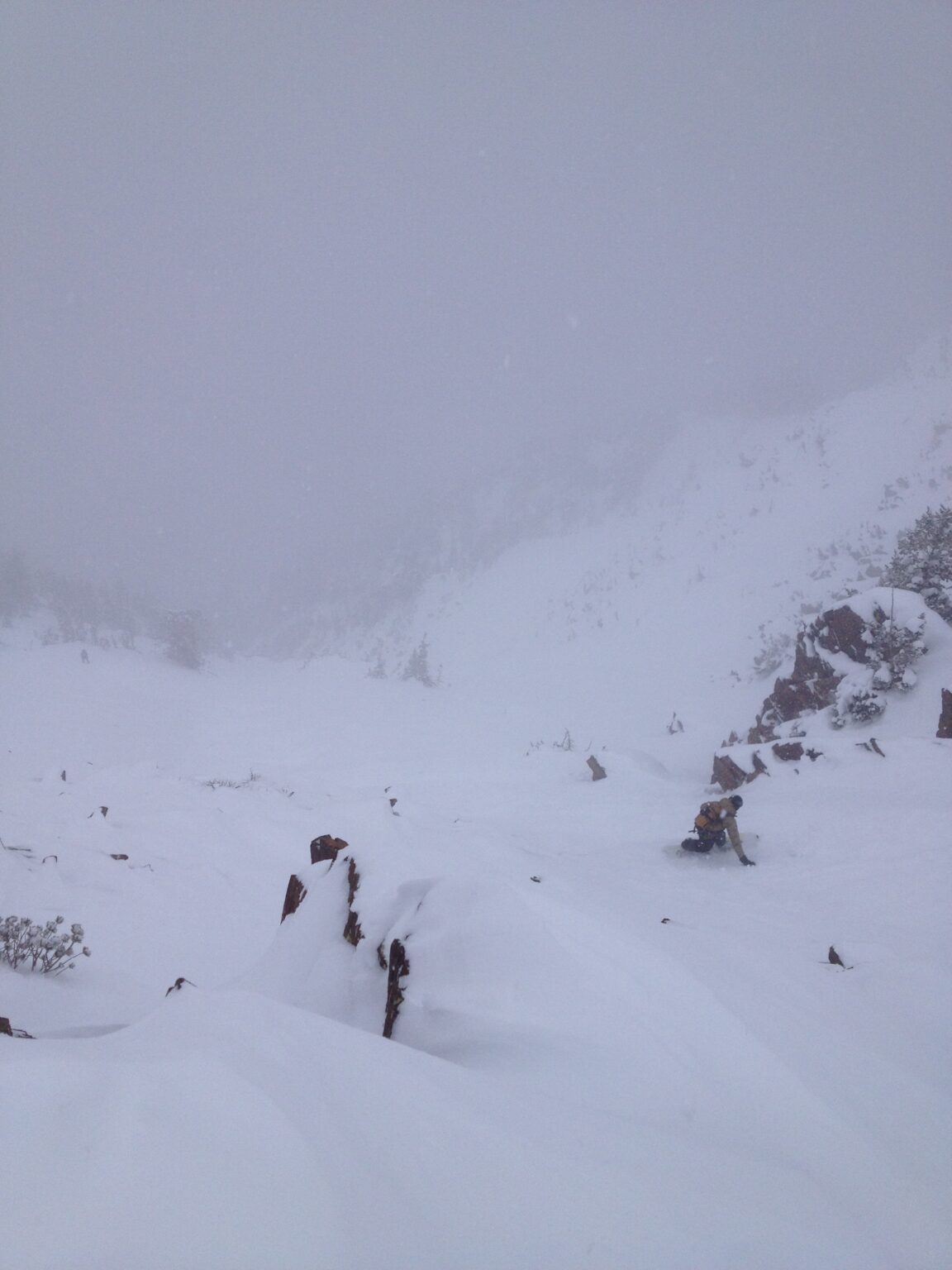 Snowboarding down the crux of the White Pine Chute