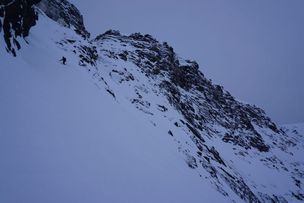 Riding onto the steep apron on Mount Aikuaivenchorr