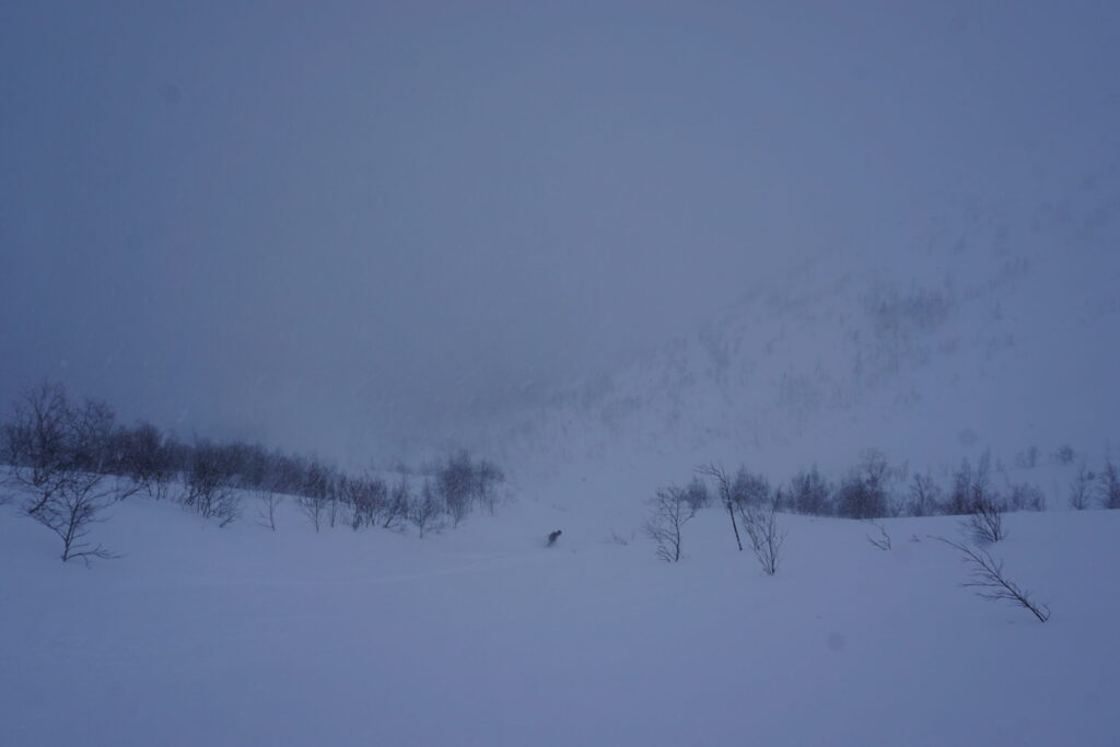 Snowboarding down a northeast gully on Mount Aikuaivenchorr